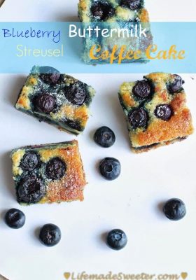 Four squares of blueberry coffee cake on a white background