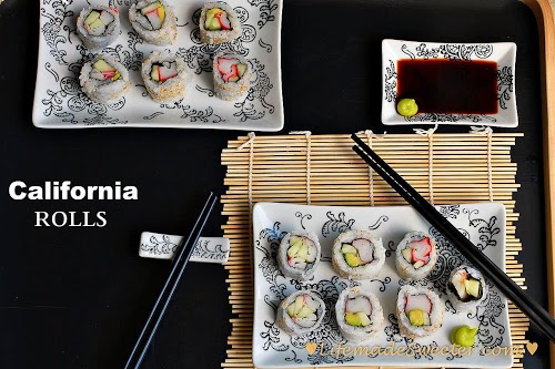 California Rolls on rectangular plates with chopsticks and a small dish of soy sauce