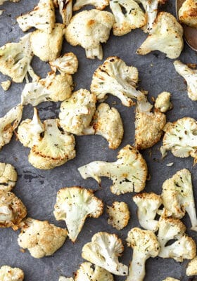 Top view of air fried cauliflower on a grey background