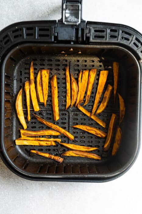 Crispy sweet potato fries in the air fryer basket