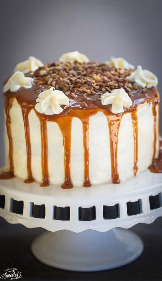 Apple Cider Spice Cake with Salted Caramel Drizzle on a white cake stand