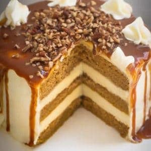 Apple Cider Spice Cake with salted caramel drizzle, with a slice removed