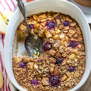 Close-up top view of Baked Oatmeal with Apples in a white casserole dish