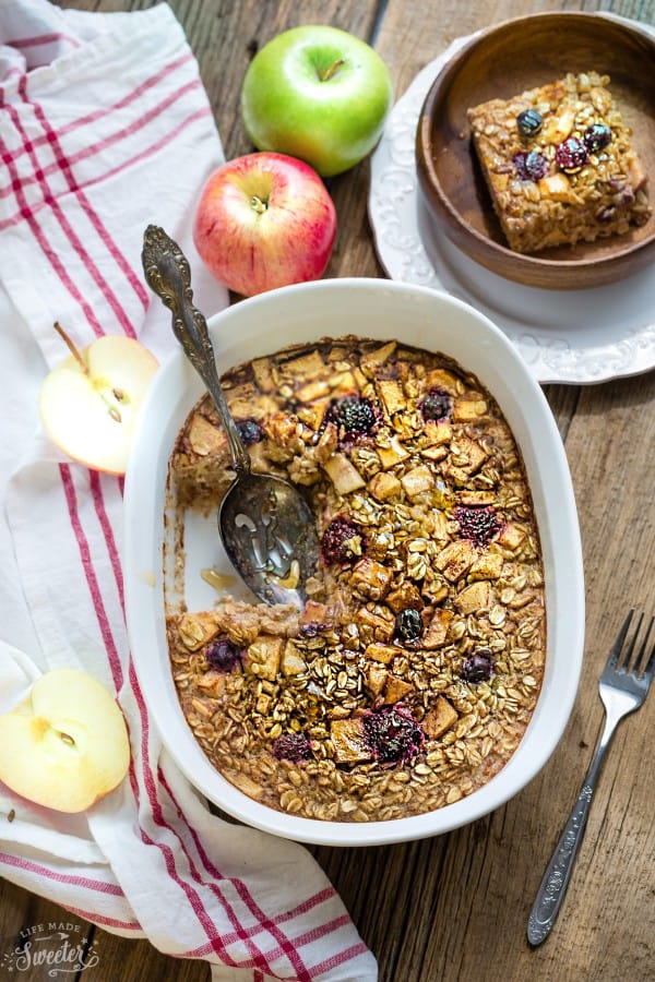 casserole dish of baked oatmeal with apples, cinnamon, and maple syrup