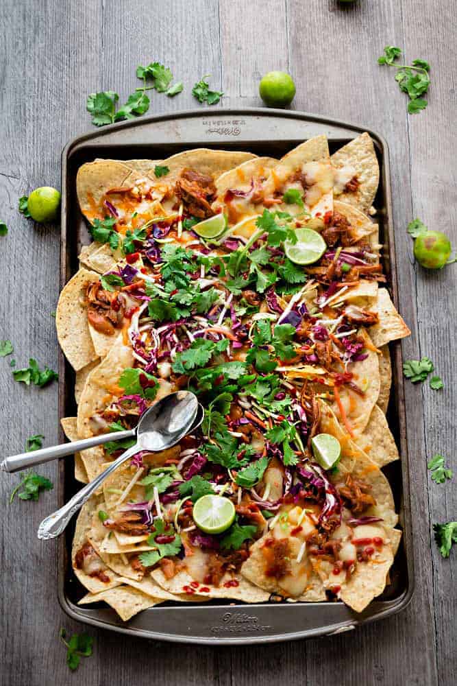 Asian Chicken Nachos - a simple and flavorful appetizer perfect for parties, game day or any meal you want. Best of all, easy to make ahead in the slow cooker or the Instant Pot.