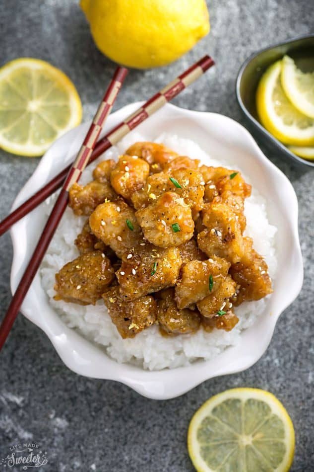 Asian Honey Lemon Chicken - coated in a refreshingly sweet. savory & tangy sauce that is even better than your local Chinese takeout restaurant! Best of all, it's full of authentic flavors and super easy to make with about 10 minutes of prep time. Instructions for pan-frying and baking in the oven.Skip that takeout menu! This is so much better and healthier! Weekly meal prep or leftovers are great for lunch bowls for work or school. 