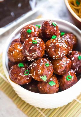 Asian Glazed Meatballs - moist and tender chicken meatballs are the perfect appetizers for game day and any Super Bowl parties. Best of all, they are so full of flavor - baked and coated in a sweet and sticky glaze.