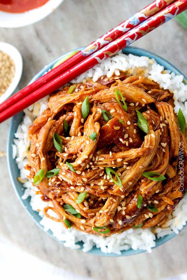 Overhead view of Slow Cooker Asian Sweet Chili Chicken over rice in a bowl