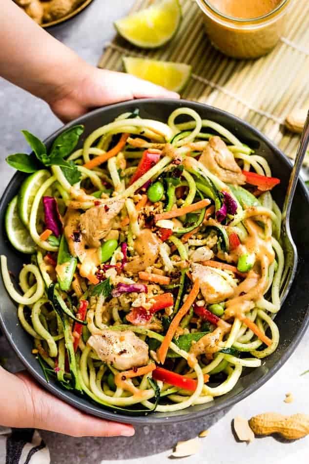 Top view of a serving bowl of Asian Zucchini Noodle Salad with Thai Peanut Dressing