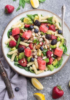Berry Avocado Spinach Pasta Salad - the perfect summer salad for easy lunches, potlucks, barbecues & parties. Best of all, this recipe comes together quickly with healthy greens, in-season fruit, chopped nuts and crumbled cheese.