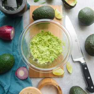 Homemade Guacamole - this quick and simple recipe is the perfect easy party dip with tortilla chips or along with tacos or by the spoonful. Best of all, only 6 ingredients to make for your next Mexican-inspired meal.