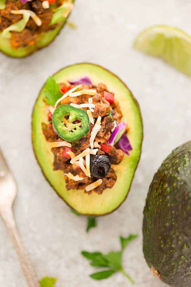 Taco Stuffed Avocado Cups – a fun appetizer based on the classic Mexican favorite and perfect for parties. Best of all, this recipe is gluten free, keto and low-carb friendly.