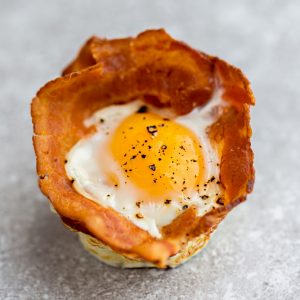 Top view of 1 Bacon Baked Egg Cup on a grey background