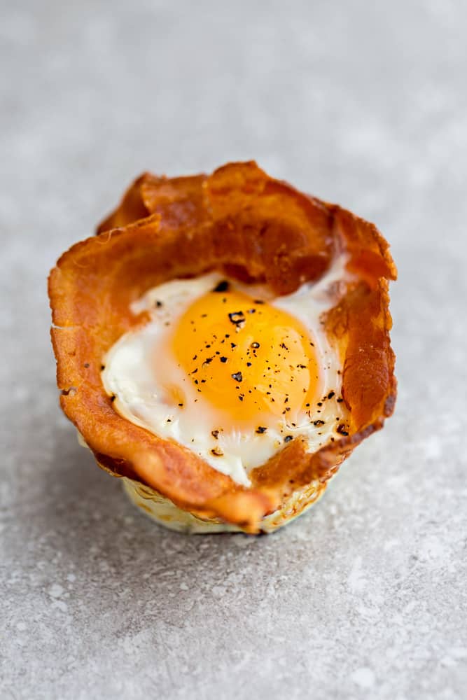 Top view of 1 Bacon Baked Egg Cup on a grey background