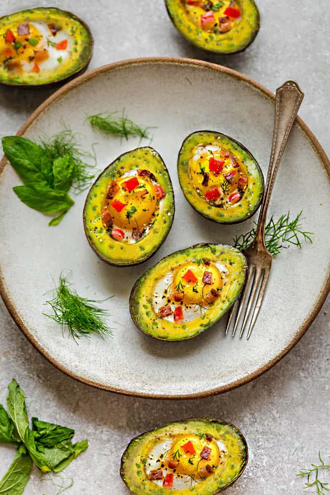 Avocado Egg Cups baked with crispy bacon and bell pepper are a super healthy and easy breakfast to start the day. Best of all, this simple recipe comes together in less than 30 minutes. Low carb, keto and paleo friendly.