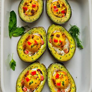 Avocado Egg Cups baked with crispy bacon and bell pepper are a super healthy and easy breakfast to start the day. Best of all, this simple recipe comes together in less than 30 minutes. Low carb, keto and paleo friendly.