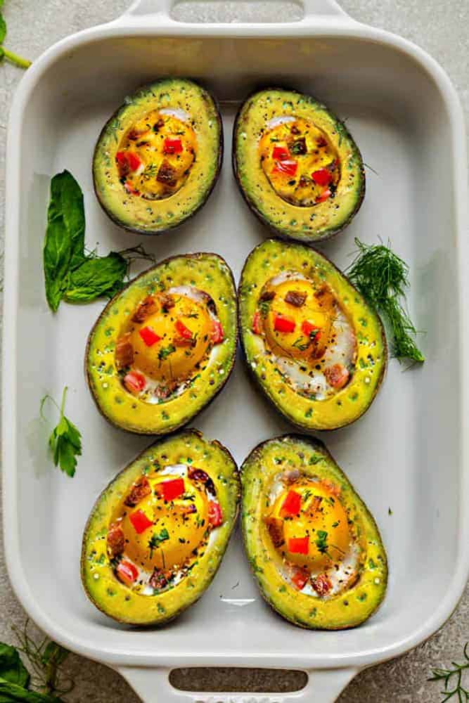 Avocado Egg Cups baked with crispy bacon and bell pepper are a super healthy and easy breakfast to start the day. Best of all, this simple recipe comes together in less than 30 minutes. Low carb, keto and paleo friendly.