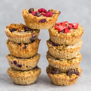 These baked oatmeal cups make the perfect easy and healthy make-ahead breakfast to enjoy throughout the week. Best of all, they're simple to customize and include recipes for 10 different ways to make them plus useful tips. Refined sugar free, gluten free and vegan. LEMON ALMOND POPPY SEED, STRAWBERRY, RASPBERRY CHOCOLATE CHIPS, PINEAPPLE COCONUT, HONEY WALNUT, ALMOND BUTTER & BANANA, PUMPKIN CRANBERRY & CARROT CAKE, CHOCOLATE CHUNK & APPLE CINNAMON