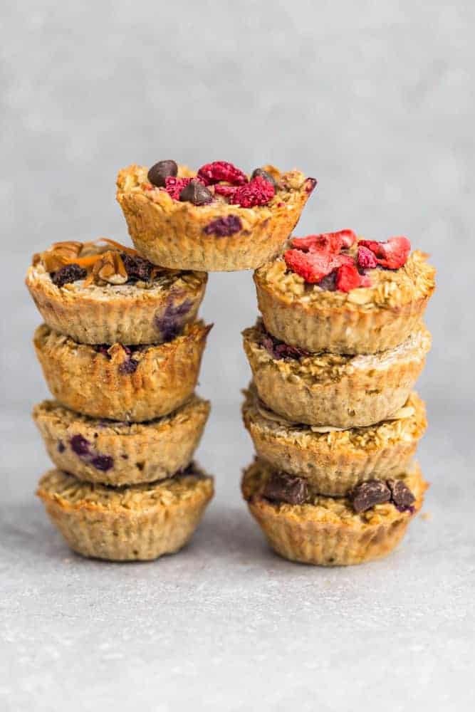 Two Stacks of Homemade Oatmeal Cups With One Cup Balanced in the Middle