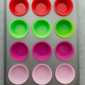 Red, Green and Pink Silicone Cupcake Liners in a Muffin Tin