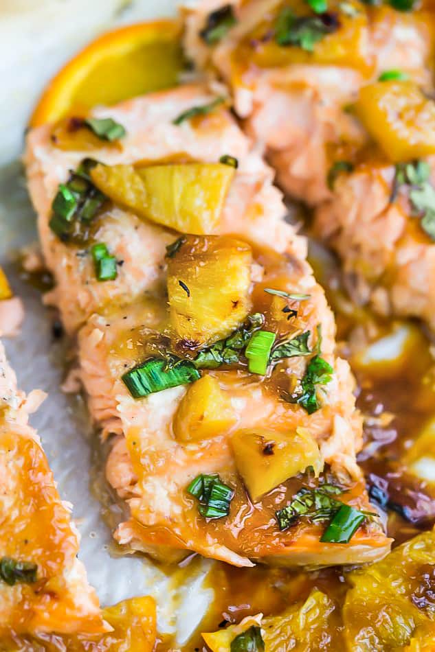 A Close-Up Shot of a Baked Teriyaki Salmon Fillet Garnished with Fresh Herbs