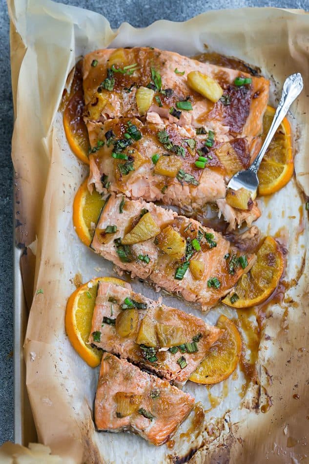 A Fork Digging Into a Freshly Baked Fillet on a Baking Sheet