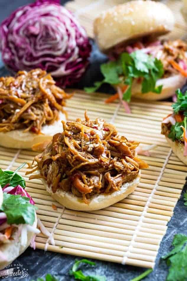 Balsamic Honey Pulled Pork Sliders on a straw mat