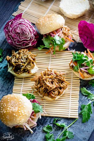 Balsamic Honey Pulled Pork Sliders make the perfect easy dinner or game day party appetizers! Best of all, the soft and tender pork comes together easily in the slow cooker or the oven so you can still watch the football game while these cook up!