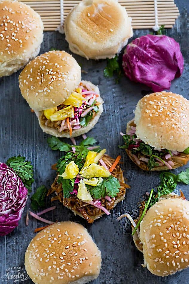 Balsamic Honey Pulled Pork Sliders make the perfect easy dinner or game day party appetizers! Best of all, the soft and tender pork comes together easily in the slow cooker or the oven so you can still watch the football game while these cook up!