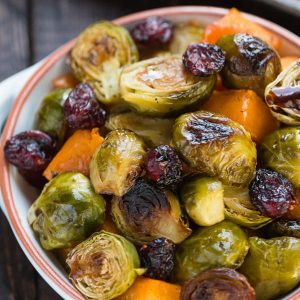 Overhead view of roasted balsamic butternut squash and brussels sprouts in a bowl