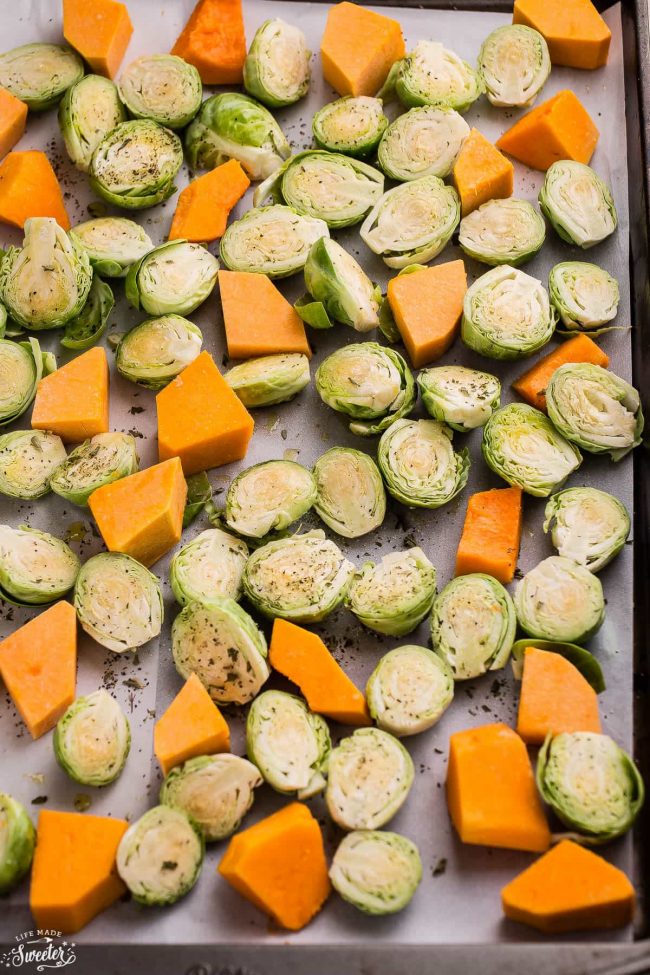 Butternut Squash chunks & Brussels Sprouts on a baking sheet