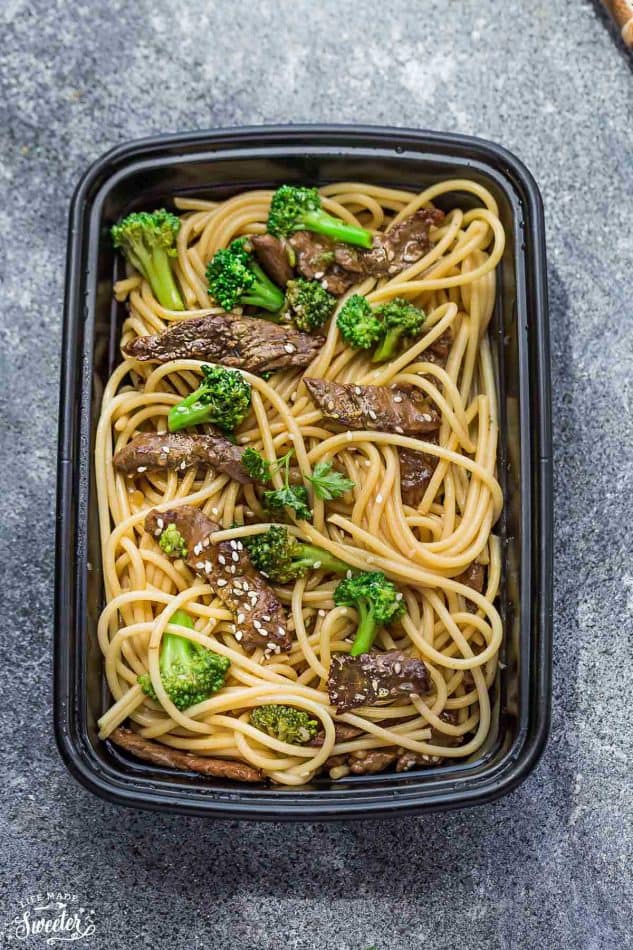 Top view of a leftover container of Beef Lo Mein Noodles with Broccoli