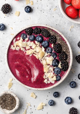 Top shot of one berry açai smoothie in a white bowl