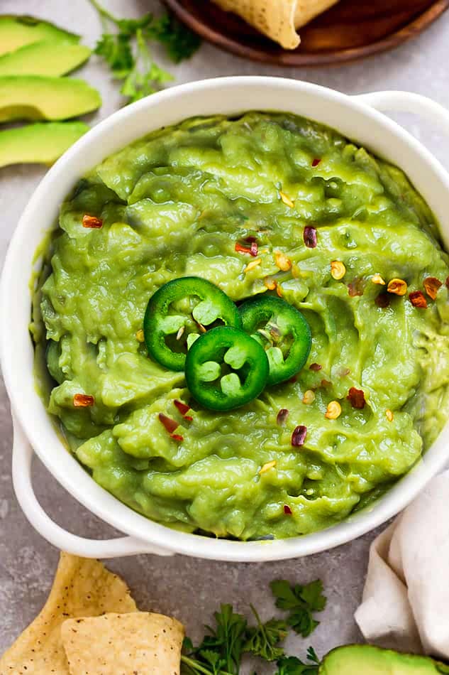 Top view of easy homemade Guacamole in a white bowl