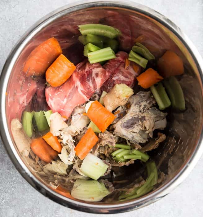 Ingredients for homemade bone broth in a Mealthy Multipot