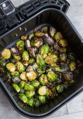 Top view of air fried Brussels sprouts in an air fryer basket