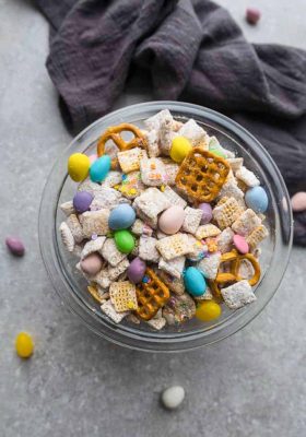 Bunny Bait – the perfect easy sweet and salty snack to munch on for spring or Easter parties. Best of all, this simple mix is fun to make with Rice Chex cereal, peanut butter, pretzels, festive Easter egg candies and confetti sprinkles.