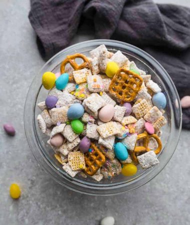 Bunny Bait – the perfect easy sweet and salty snack to munch on for spring or Easter parties. Best of all, this simple mix is fun to make with Rice Chex cereal, peanut butter, pretzels, festive Easter egg candies and confetti sprinkles.