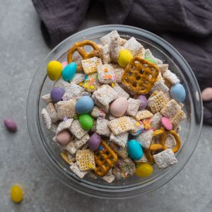 Bunny Bait - the perfect easy sweet and salty snack to munch on at spring or Easter parties. Best of all, this simple mix is fun to make with Rice Chex cereal, cashews, peanut butter, pretzels and Easter M&M's.