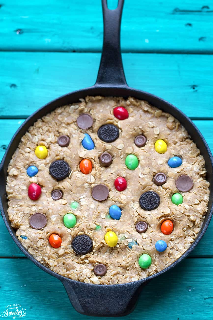 Overhead view of Candy Oreo Monster Skillet Cookie Pizza in a cast-iron skillet