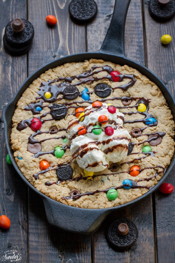 Candy Oreo Monster Skillet Cookie Pizza topped with candy and ice cream