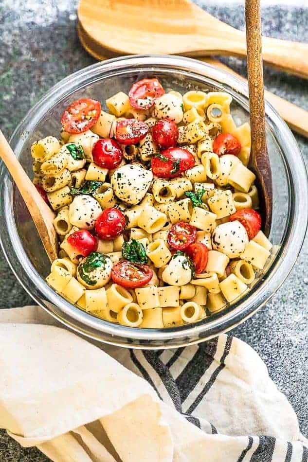 Top view of Caprese Pasta Salad in a glass bowl