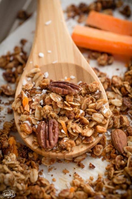 Close-up of Carrot Cake Granola on a wooden spoon