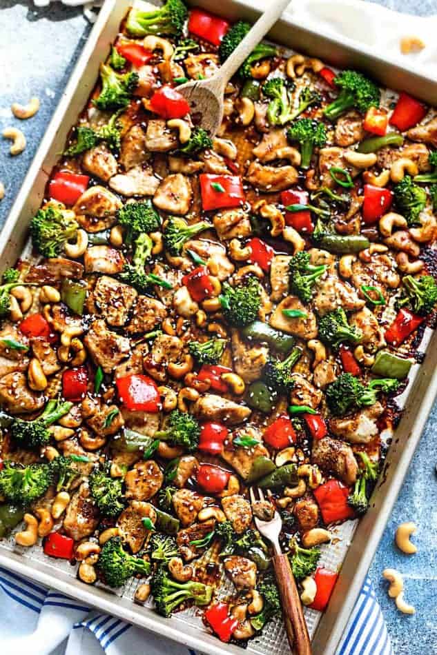 Top view of a sheet pan of Cashew Chicken and vegetables