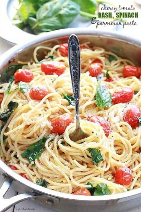 Cherry Tomato, Basil, Spinach and Parmesan Pasta - An easy meatless weeknight meal that comes together in as little as 20 minutes with fresh basil, cherry tomatoes, baby spinach, parmesan and pasta. by @LifeMadeSweeter