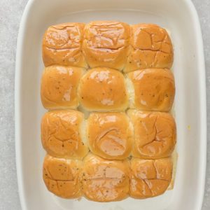 Top view of a dozen rolls in a rectangular baking dish