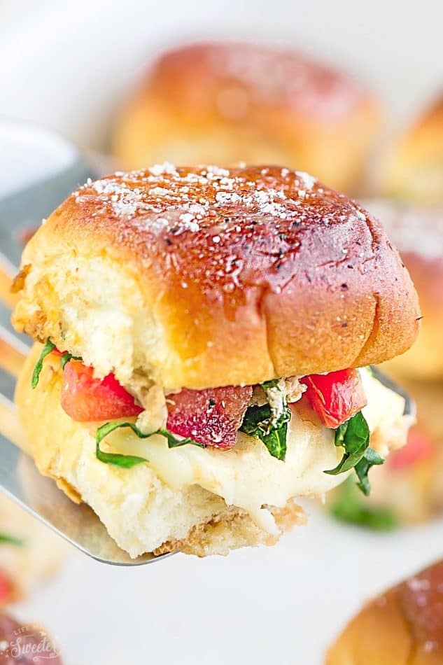 Close-up of an Italian Chicken Bruschetta Slider on a serving spatula