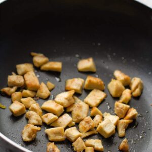 Cubed chicken breast in a pan