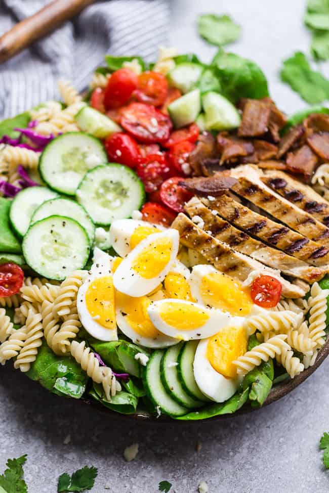 Cobb Pasta Salad - an easy side dish perfect for summer parties, picnics, potlucks and BBQ's. Made with bacon, avocado, grilled chicken, tomatoes, hard-boiled eggs, cheese, and a homemade ranch dressing.