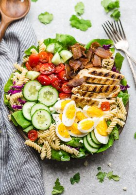 Cobb Pasta Salad - an easy side dish perfect for summer parties, picnics, potlucks and BBQ's. Made with bacon, cucumbers, grilled chicken, tomatoes, hard-boiled eggs, cheese, and a homemade ranch dressing.